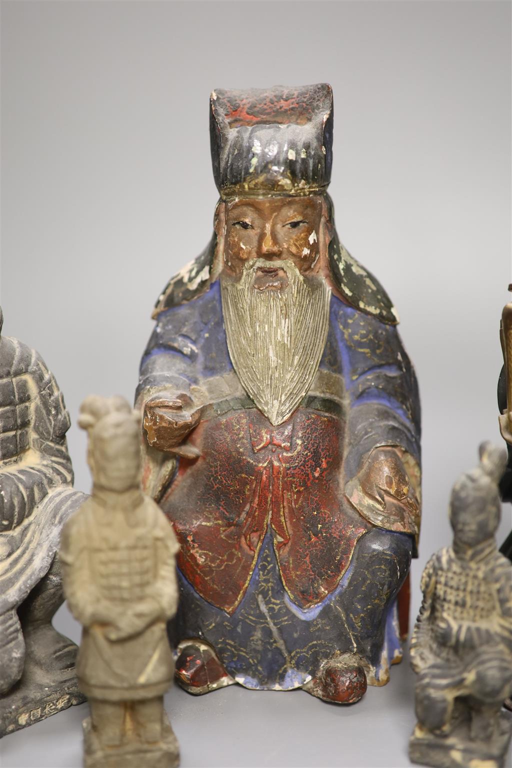 Five various Chinese pottery figures, a composite figure and a painted wood figure, tallest 20cm